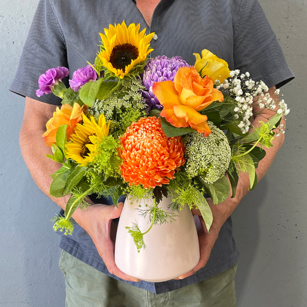 Bright flower arrangement in ceramic vase by Cyril Cooke Florists Geelong