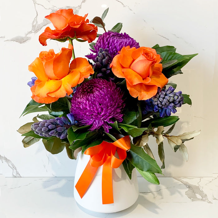 Retro Vibes bright orange and purple vase arrangement by Cyril Cooke Florists Geelong