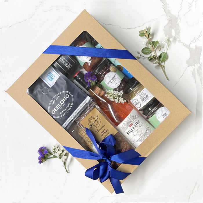 The Local Geelong hamper featuring Bellarine Estate First Blush Rosé, Pennyroyal pita crisps, capsicum relish, Otway honey, Geelong Coffee Roasters coffee, Mount Moriac olive oil, Adelia Bellarine brownies, raspberry preserve, pistachio dukkha and Lovecraft soy candle